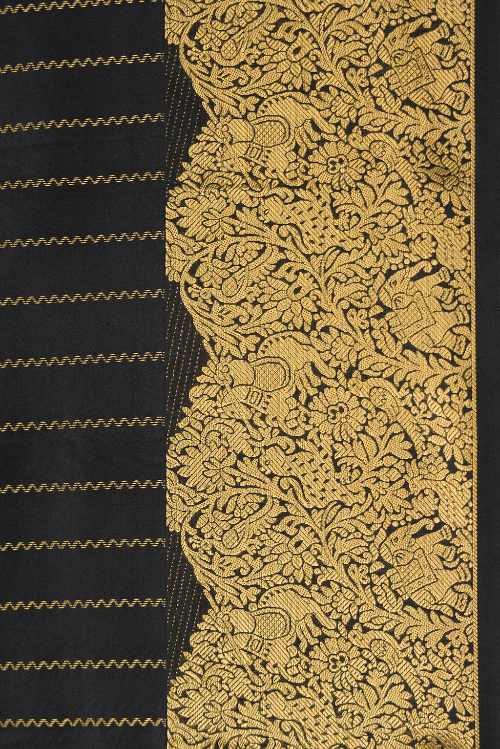 Border image of Black Dual Tone Kanchipuram Silk Saree with Stripes on the body and Fancy Border. 