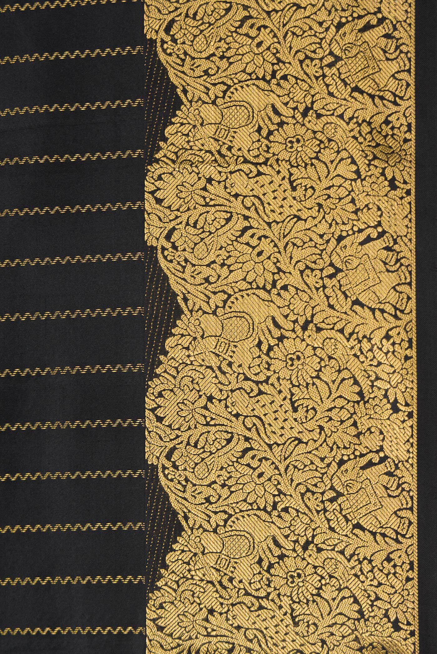 Border image of Black Dual Tone Kanchipuram Silk Saree with Stripes on the body and Fancy Border. 