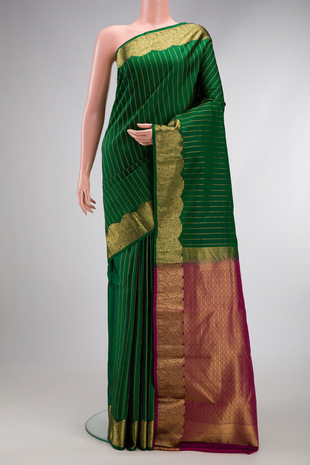 Bottle Green Dual Tone Kanchipuram Silk Saree with Stripes on the body and Fancy Border.  displayed on a mannequin