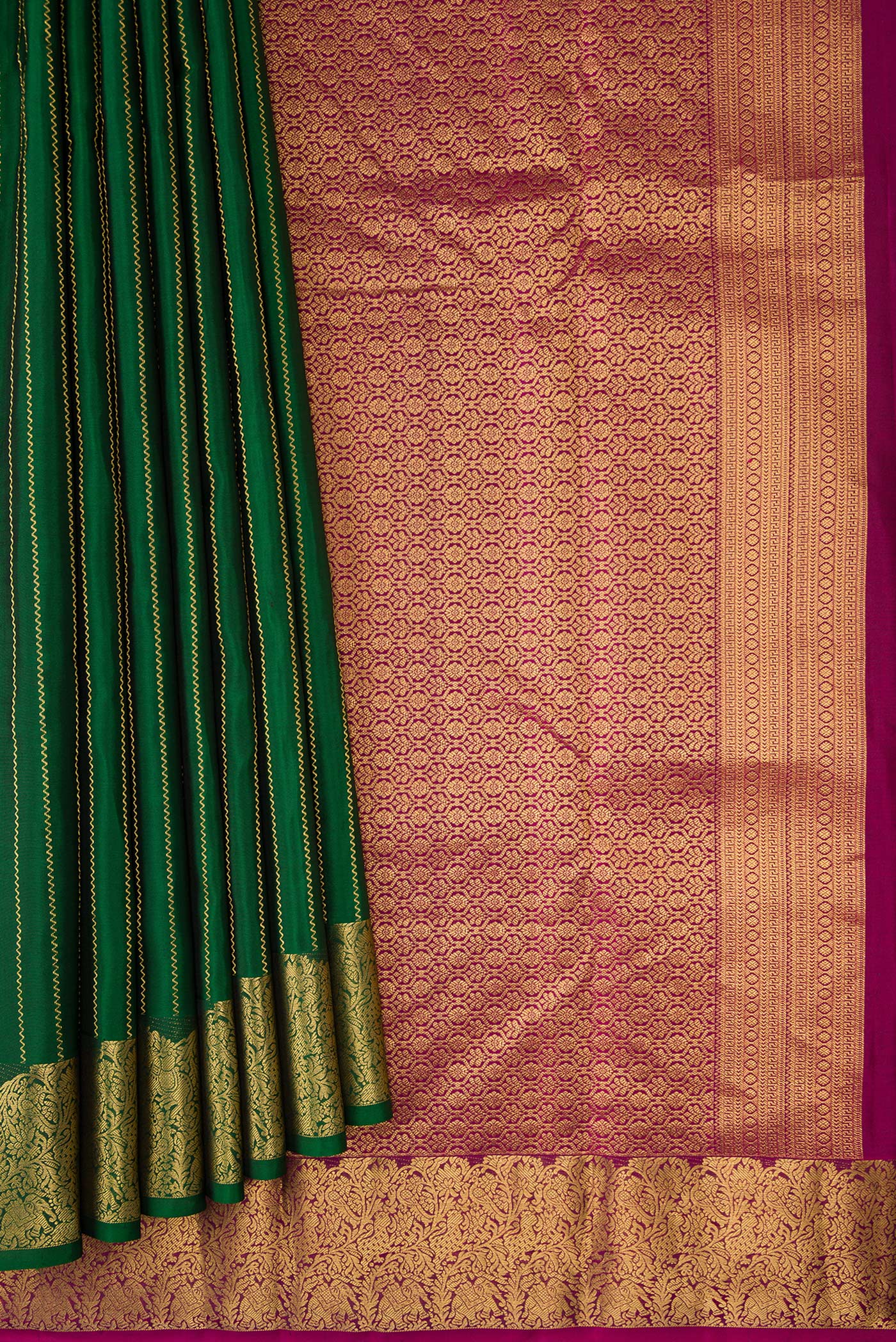 Pleats and pallu of Bottle Green Dual Tone Kanchipuram Silk Saree with Stripes on the body and Fancy Border. 