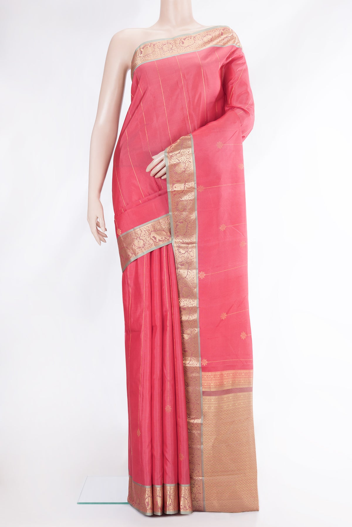 Pink Dual Tone Kanchipuram Silk Saree with Stripes on the body and Zari Border.  displayed on a mannequin