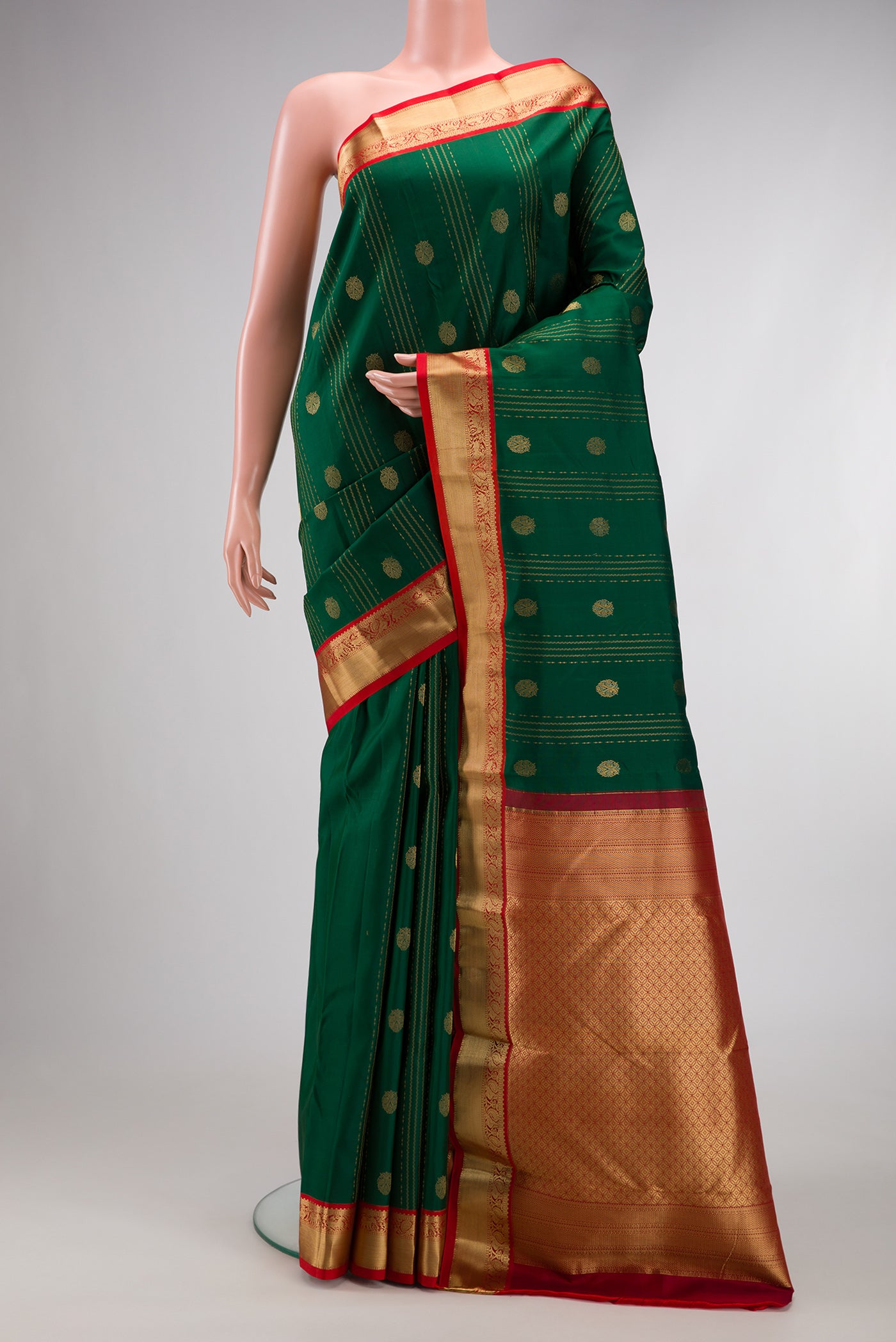 Green Dual Tone Kanchipuram Silk Saree with Stripes on the body and Zari Border.  displayed on a mannequin