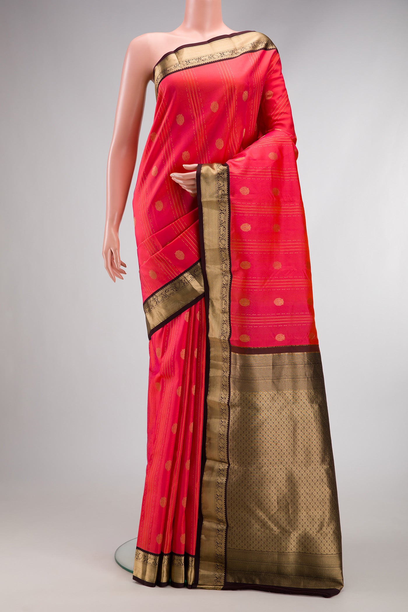 Coral Dual Tone Kanchipuram Silk Saree with Jacquard With Zari Butta on the body and Zari Border.  displayed on a mannequin