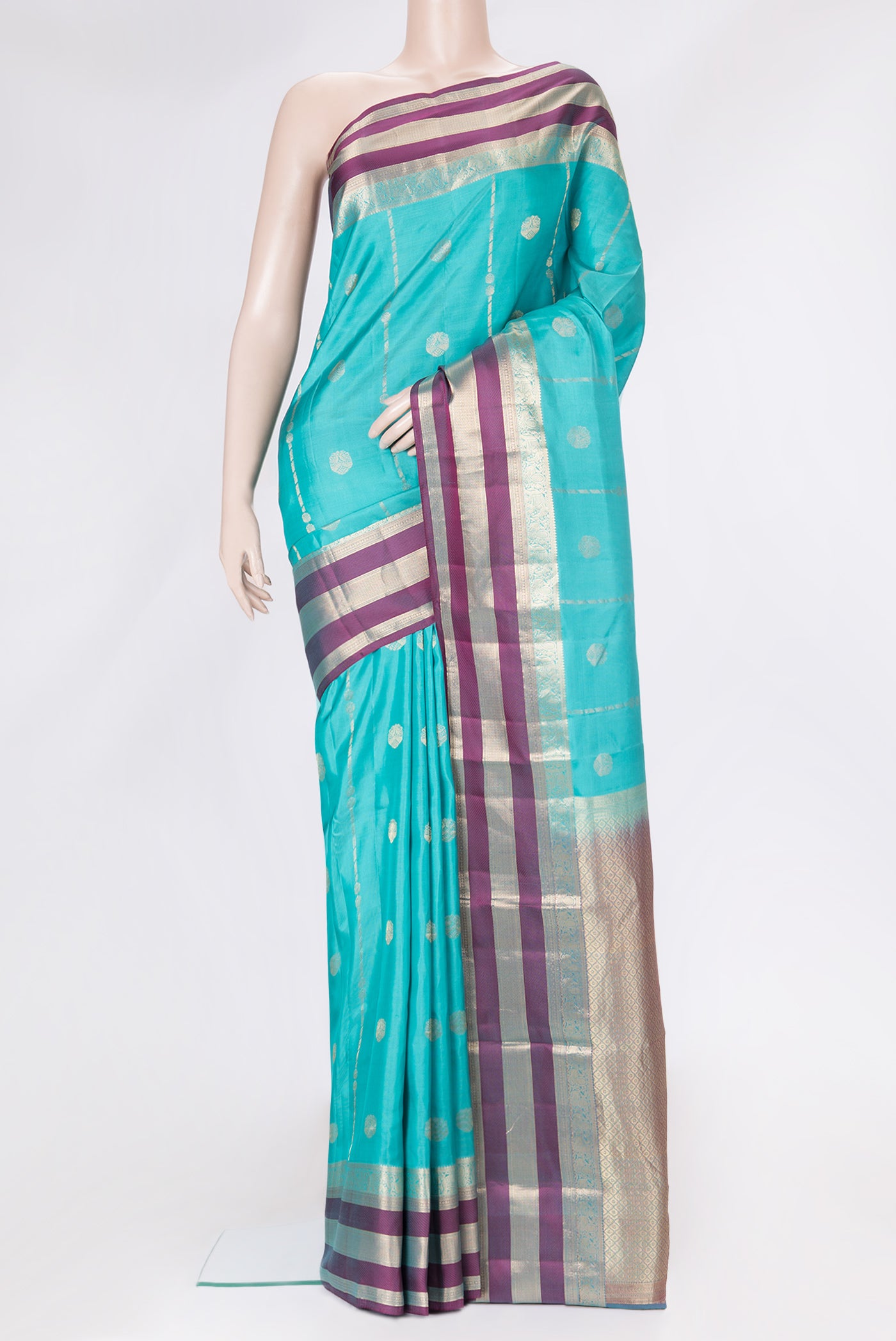 Sky Blue Dual Tone Kanchipuram Silk Saree with Zari Butta on the body and Zari Border.  displayed on a mannequin