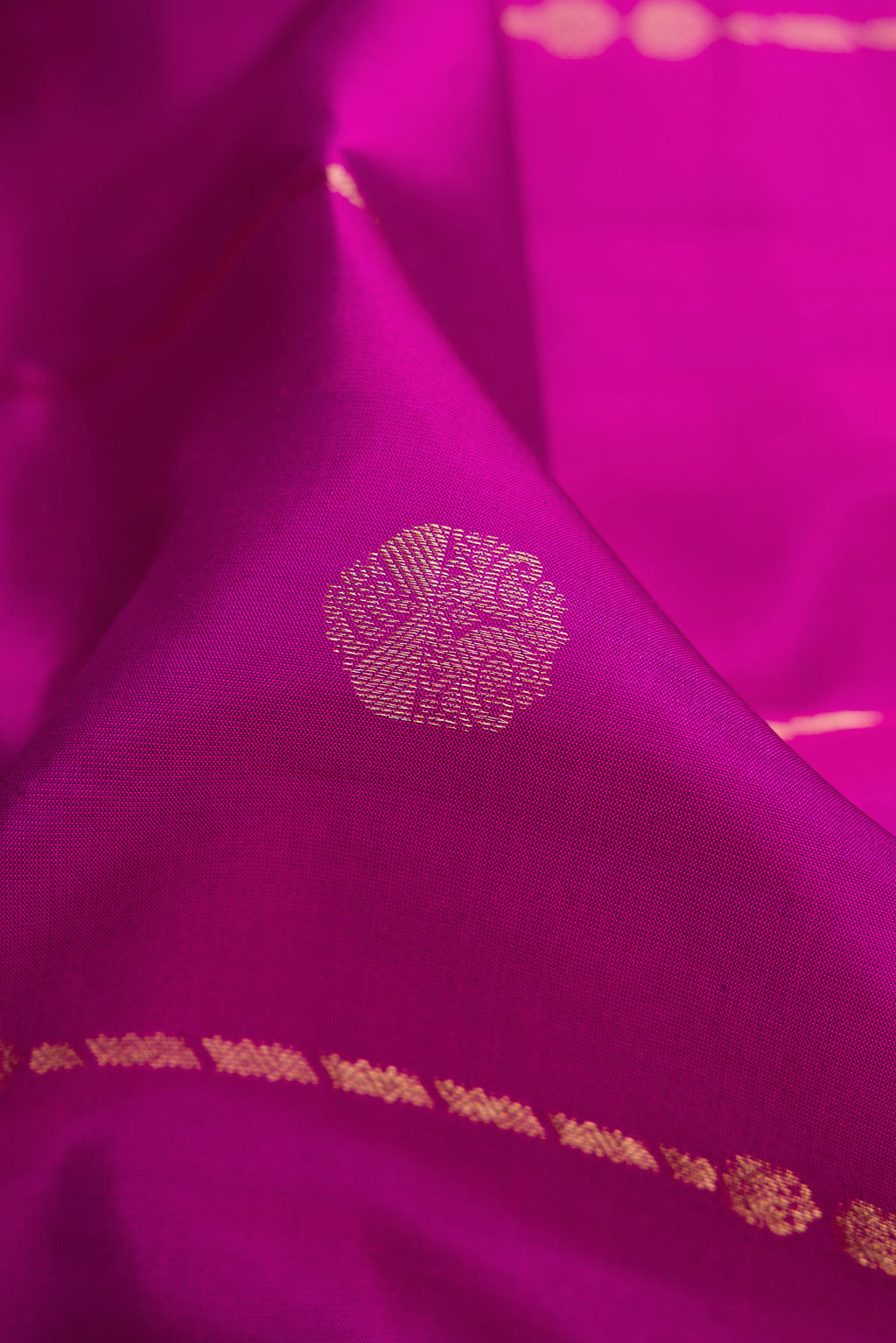 Close up of Purple Dual Tone Kanchipuram Silk Saree with Zari Butta on the body and Zari Border.  displaying folds
