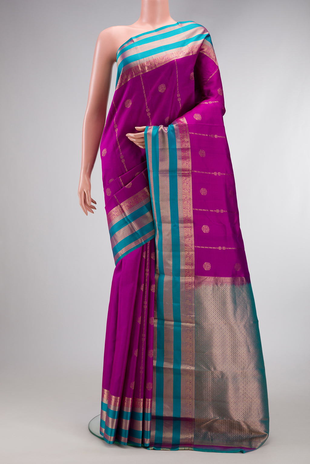 Purple Dual Tone Kanchipuram Silk Saree with Zari Butta on the body and Zari Border.  displayed on a mannequin