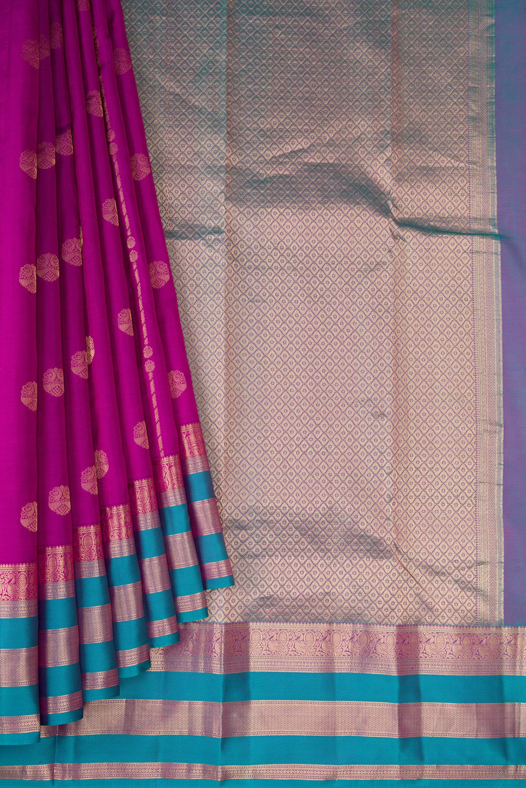 Pleats and pallu of Purple Dual Tone Kanchipuram Silk Saree with Zari Butta on the body and Zari Border. 