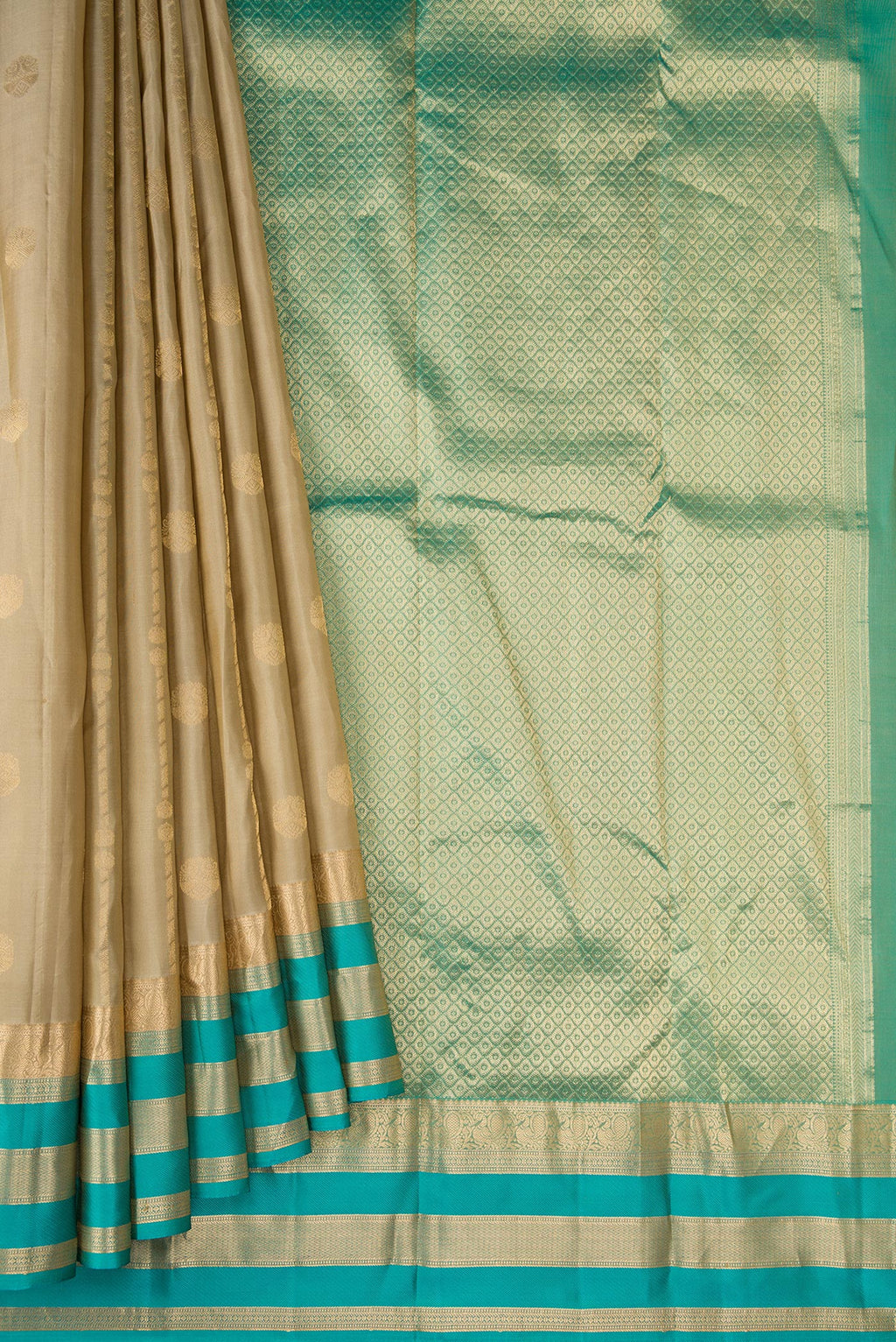Pleats and pallu of Dark Beige Dual Tone Kanchipuram Silk Saree with Zari Butta on the body and Zari Border. 