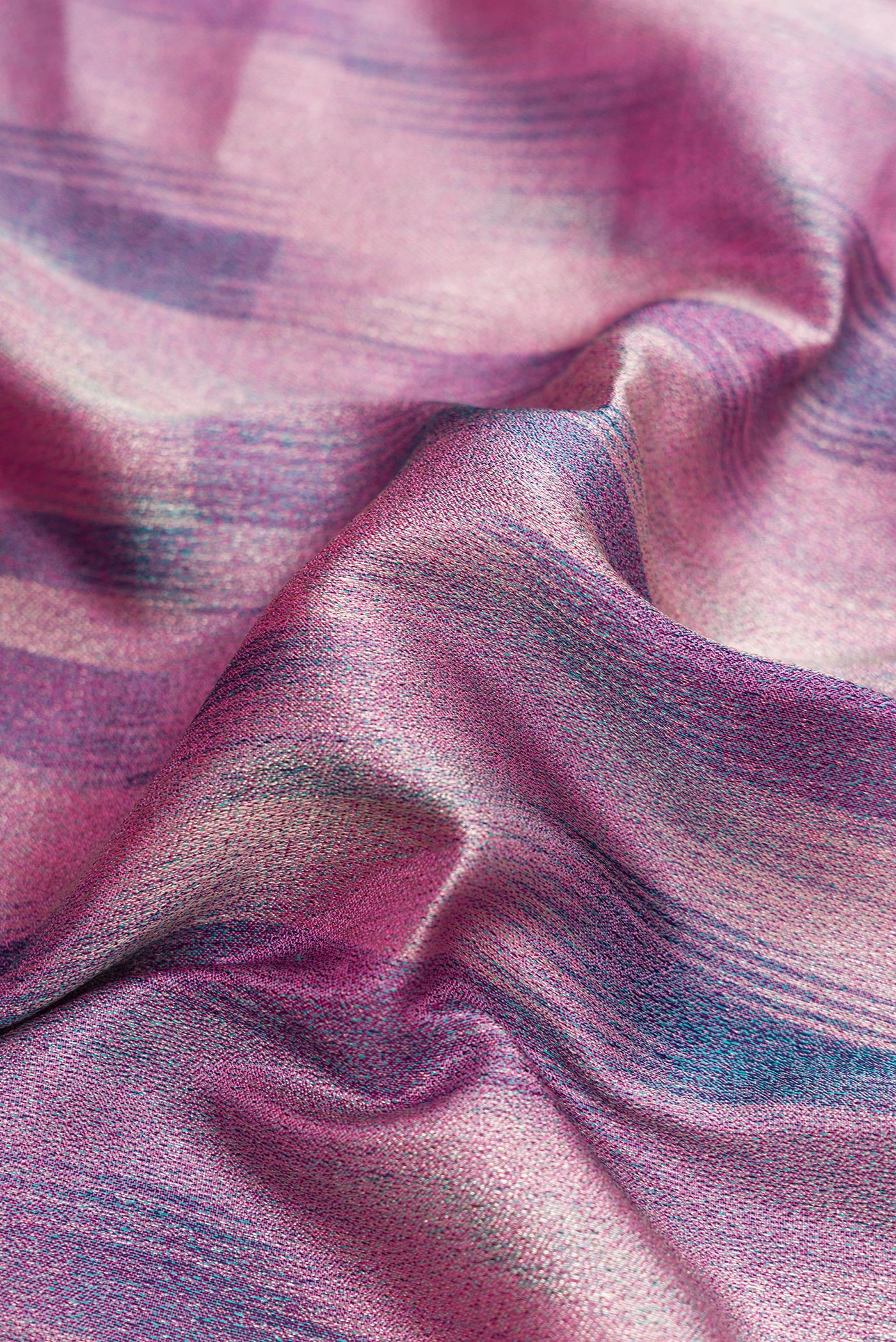 Close up of Lavender Dual Tone Kanjivaram Tissue Silk Saree with Zari Brocade on the body and Fancy Border.  displaying folds