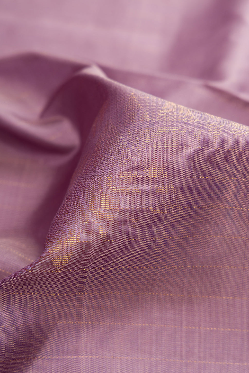 Close up of Lilac Dual Tone Soft Silk Saree with Zari Butta on the body and Zari Border.  displaying folds