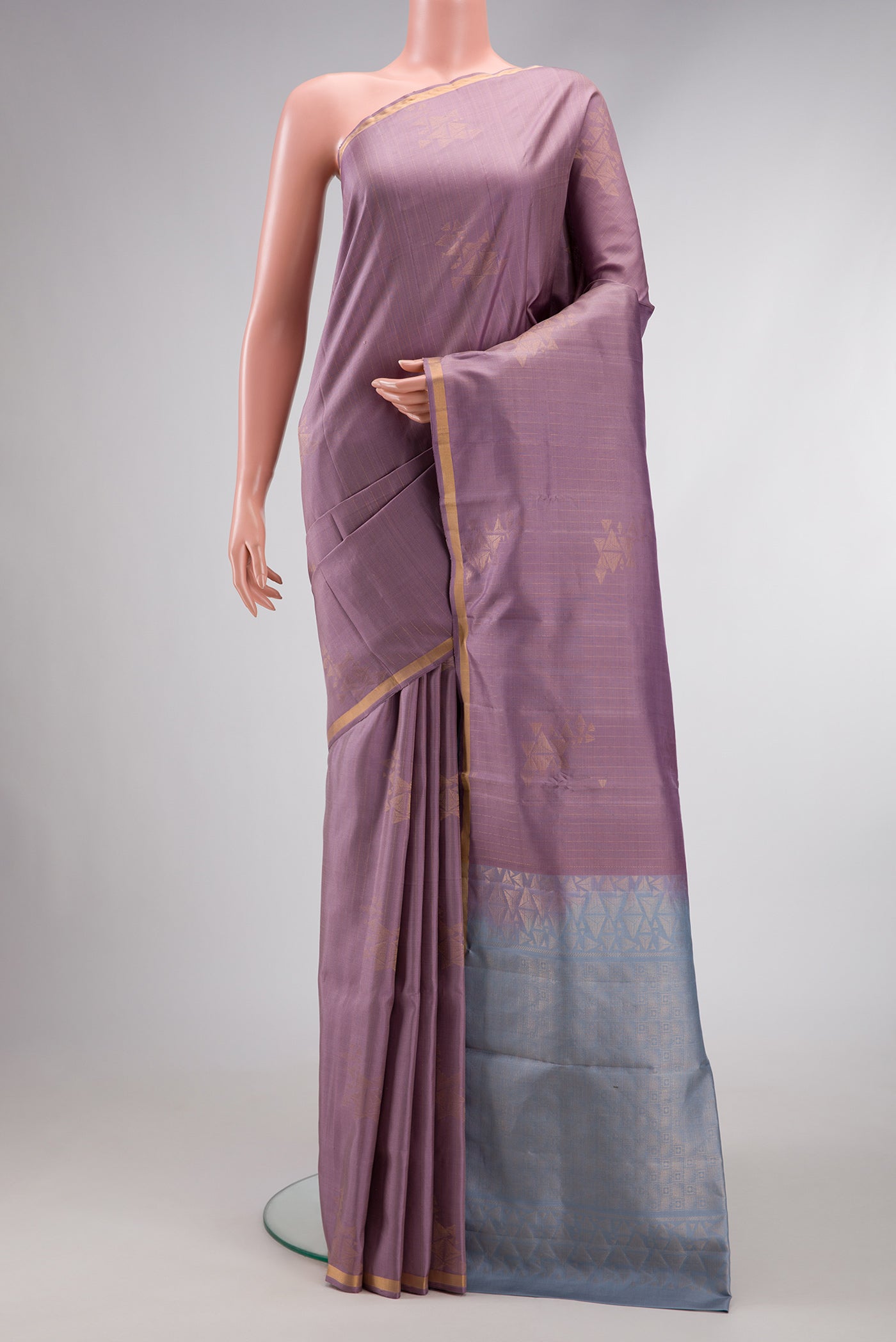 Lilac Dual Tone Soft Silk Saree with Zari Butta on the body and Zari Border.  displayed on a mannequin
