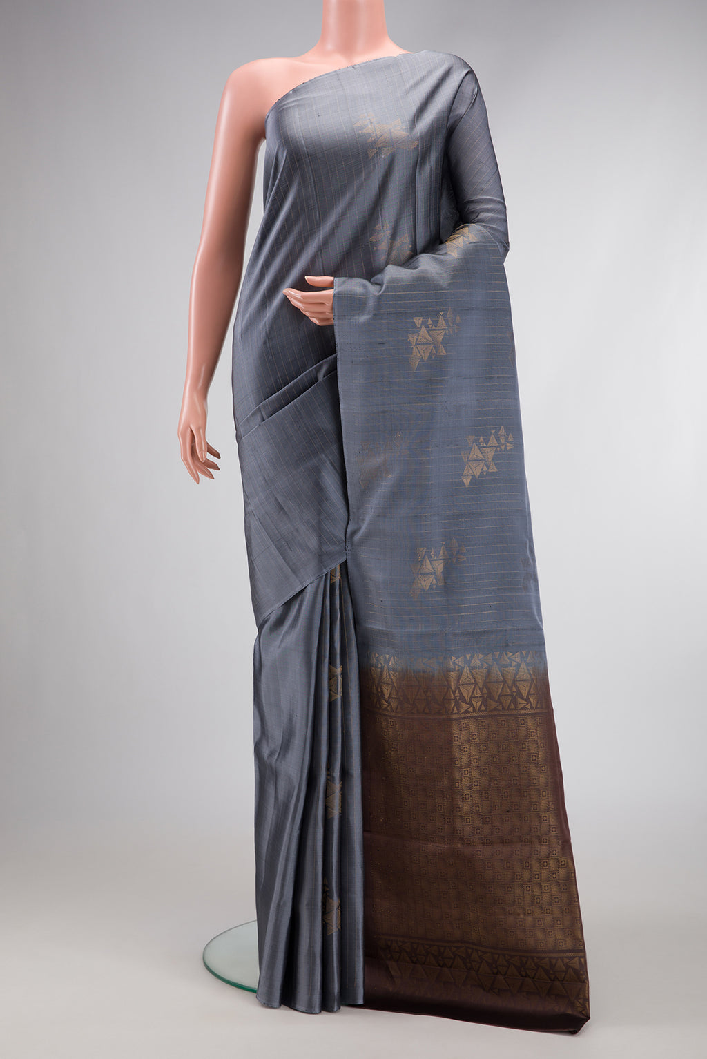 Grey Dual Tone Soft Silk Saree with Stripes on the body and Without Border.  displayed on a mannequin