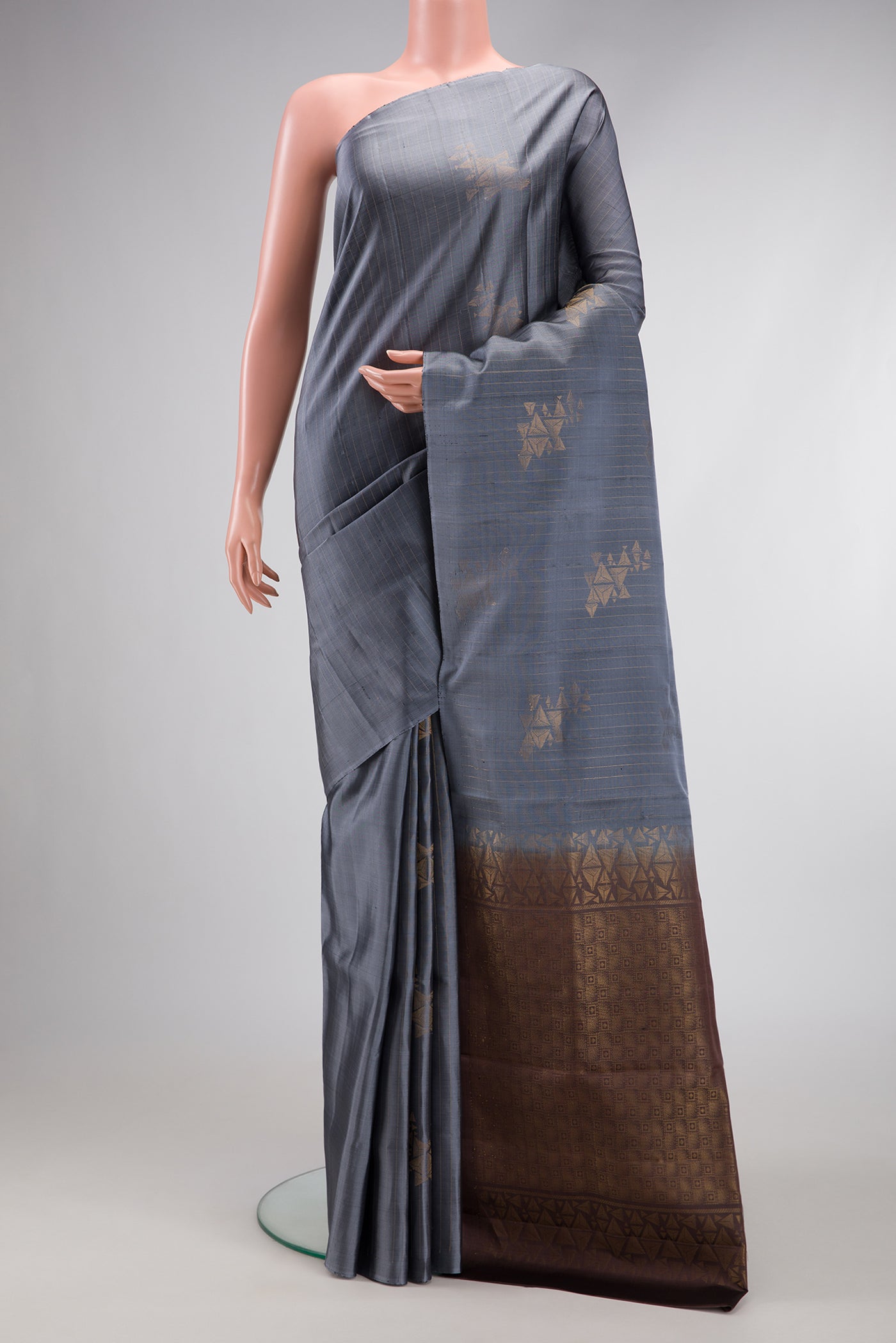 Grey Dual Tone Soft Silk Saree with Stripes on the body and Without Border.  displayed on a mannequin