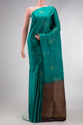 Green Dual Tone Soft Silk Saree with Zari Butta on the body and Without Border.  displayed on a mannequin