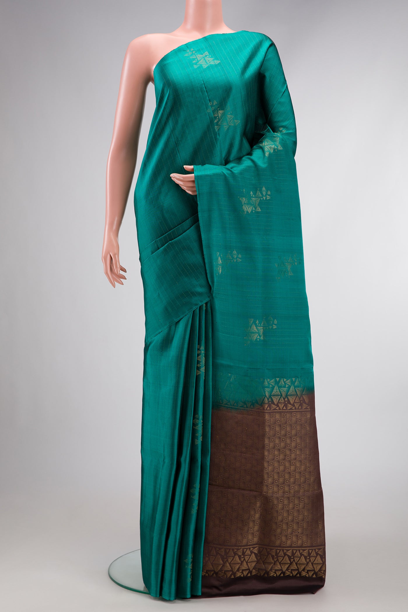 Green Dual Tone Soft Silk Saree with Zari Butta on the body and Without Border.  displayed on a mannequin