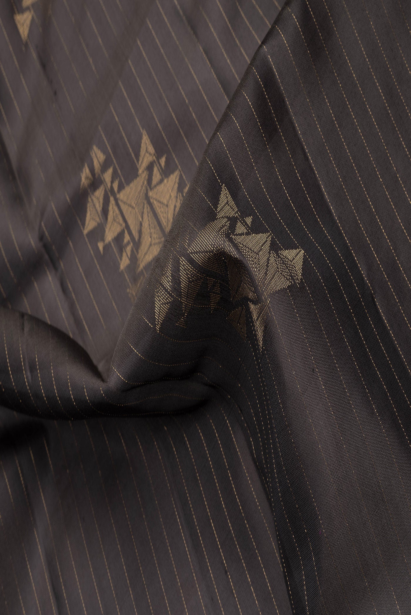 Close up of Coffee Brown Dual Tone Soft Silk Saree with Stripes on the body and Without Border.  displaying folds