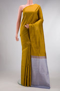 Mehandi Green Dual Tone Soft Silk Saree with Zari Butta on the body and Without Border.  displayed on a mannequin