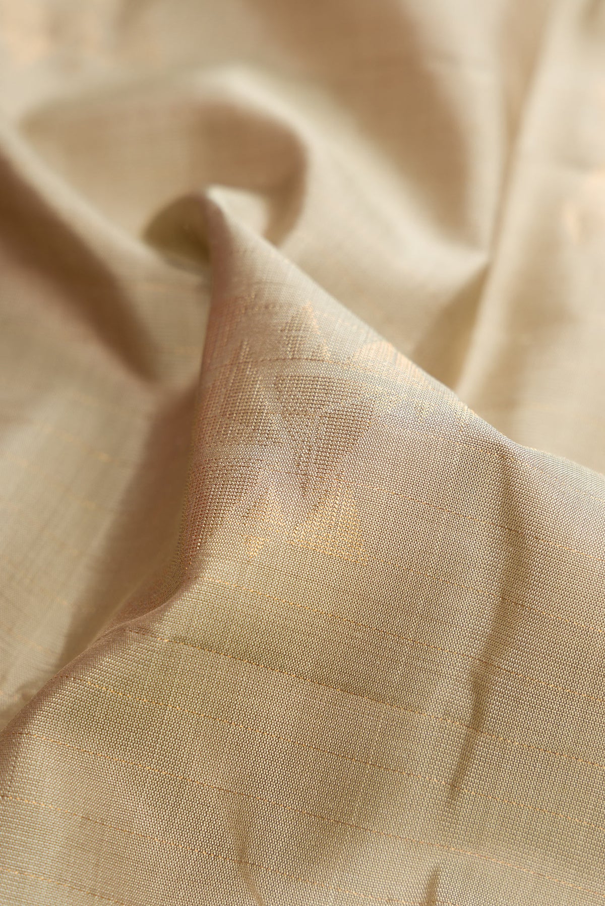 Close up of Pista Green Dual Tone Soft Silk Saree with Zari Butta on the body and Without Border.  displaying folds