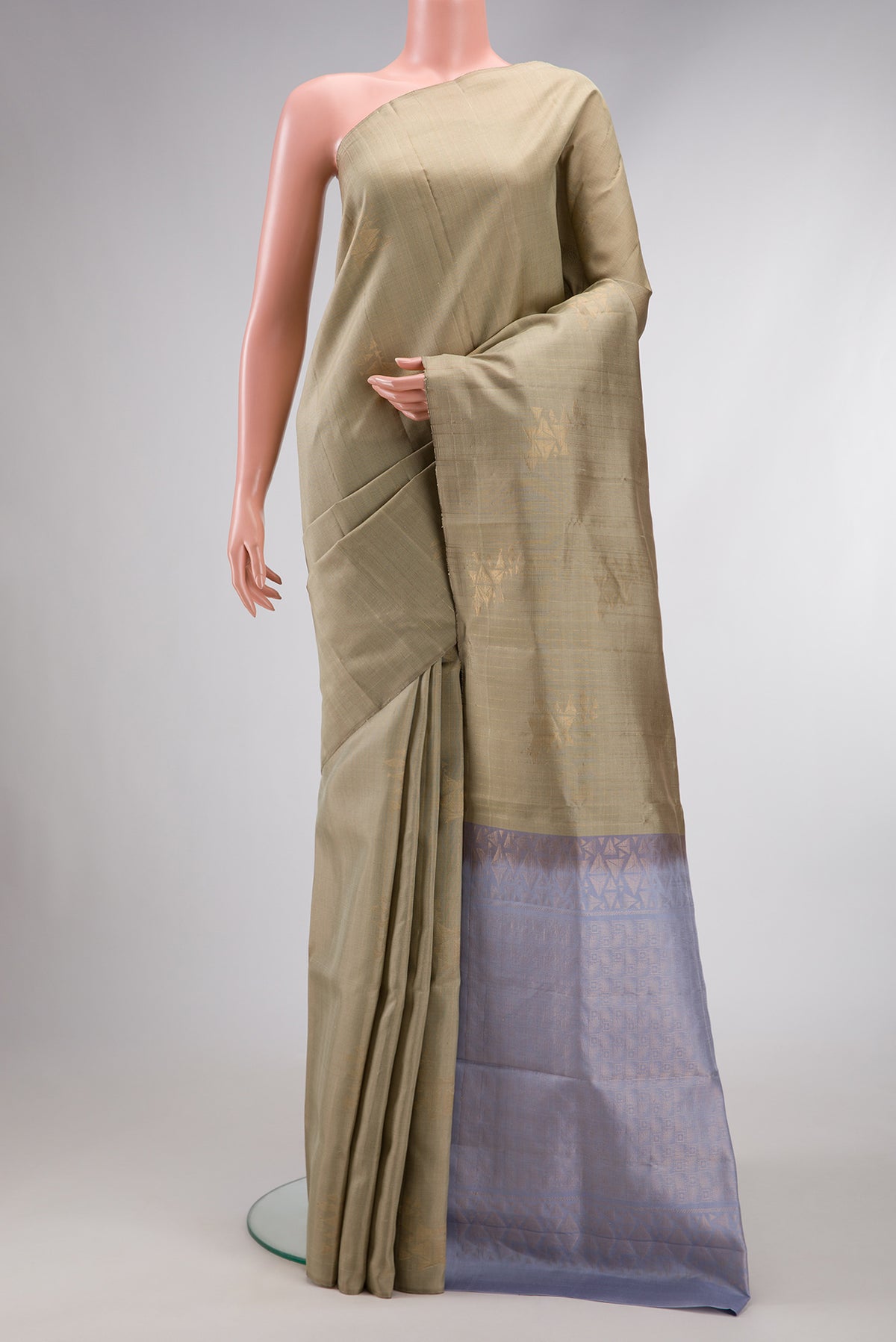 Pista Green Dual Tone Soft Silk Saree with Zari Butta on the body and Without Border.  displayed on a mannequin