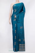 Peacock Blue Soft Silk Saree with Zari Butta on the body and Without Border.  displayed on a mannequin
