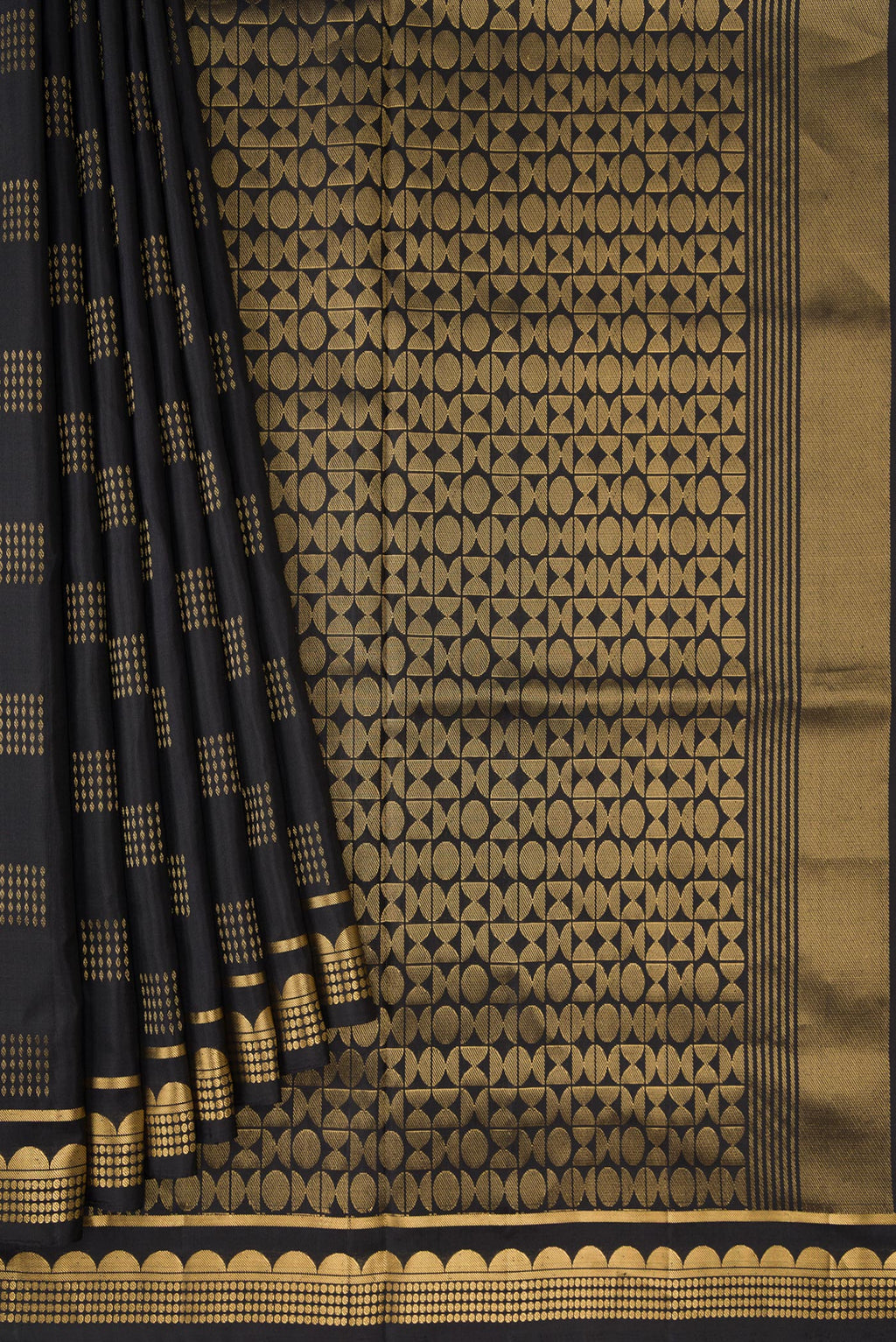 Pleats and pallu of Black Dual Tone Soft Silk Saree with Zari Butta on the body and Fancy Border. 