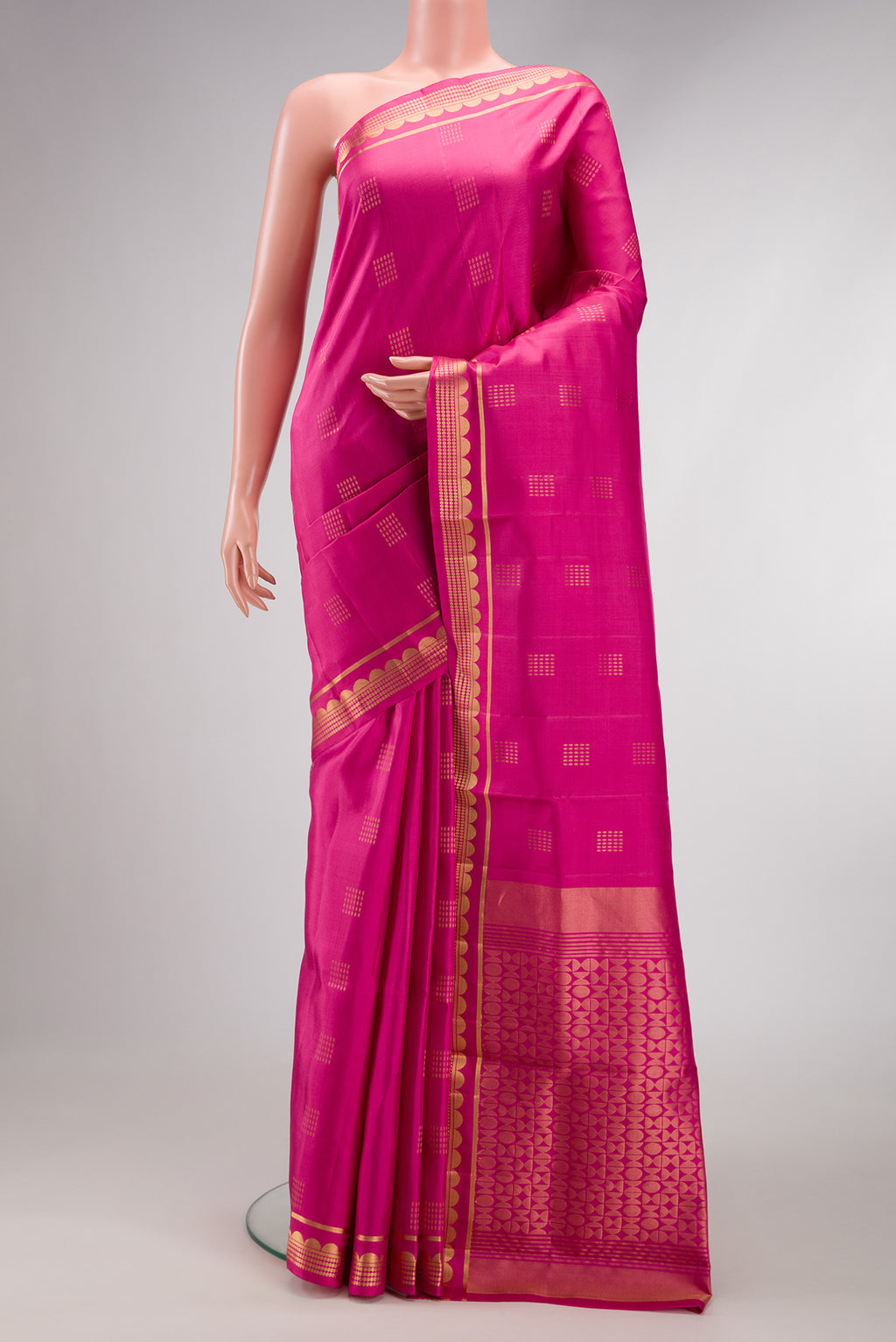 Pink Dual Tone Soft Silk Saree with Zari Butta on the body and Fancy Border.  displayed on a mannequin