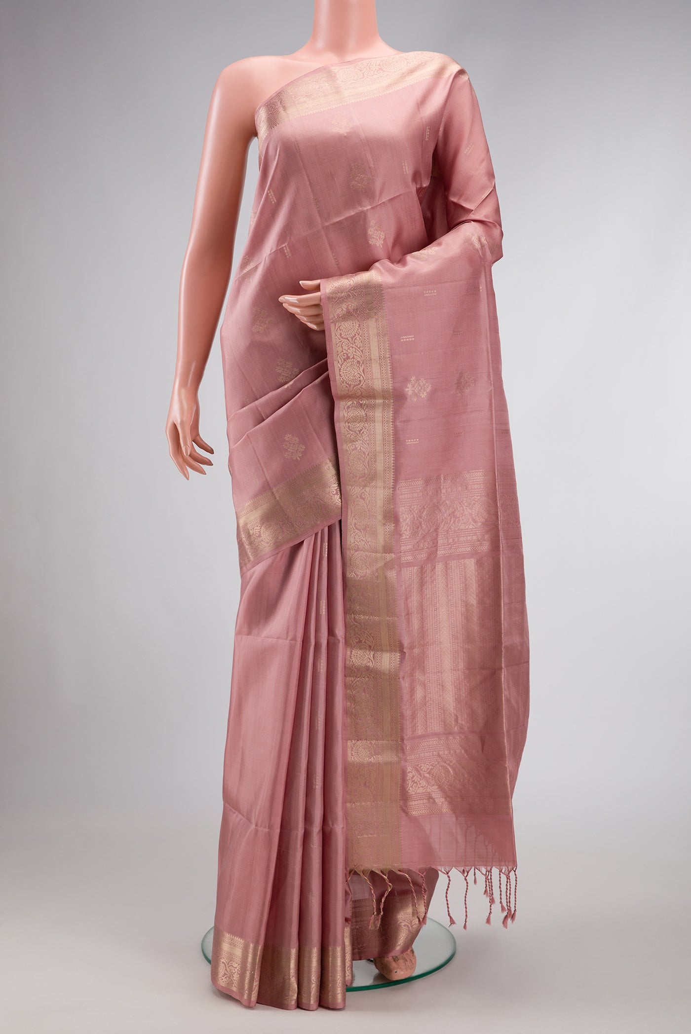 Rose Gold Dual Tone Soft Silk Saree with Zari Butta on the body and Zari Border.  displayed on a mannequin