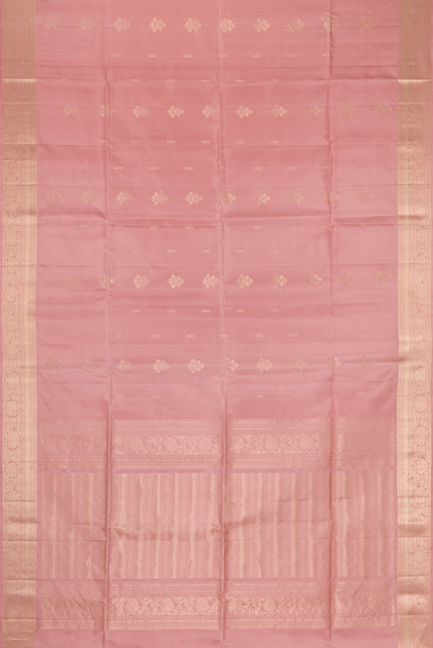 Flat view of Rose Gold Dual Tone Soft Silk Saree with Zari Butta on the body and Zari Border. 