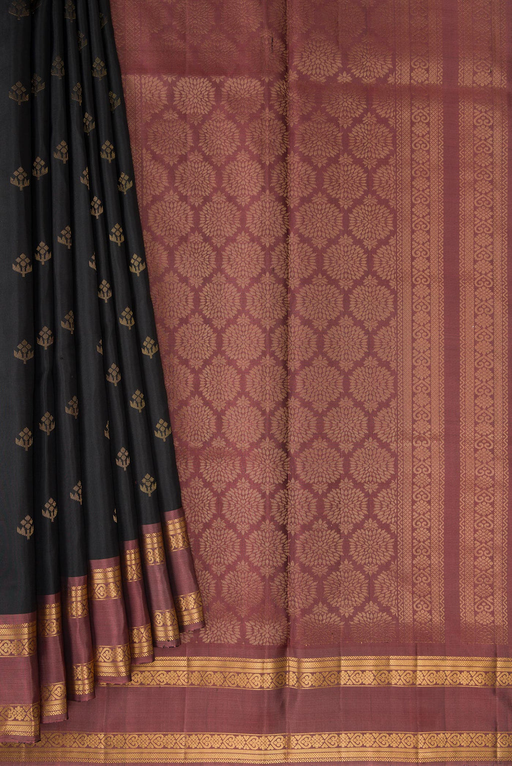 Pleats and pallu of Black Dual Tone Soft Silk Saree with Zari Butta on the body and Zari Border. 