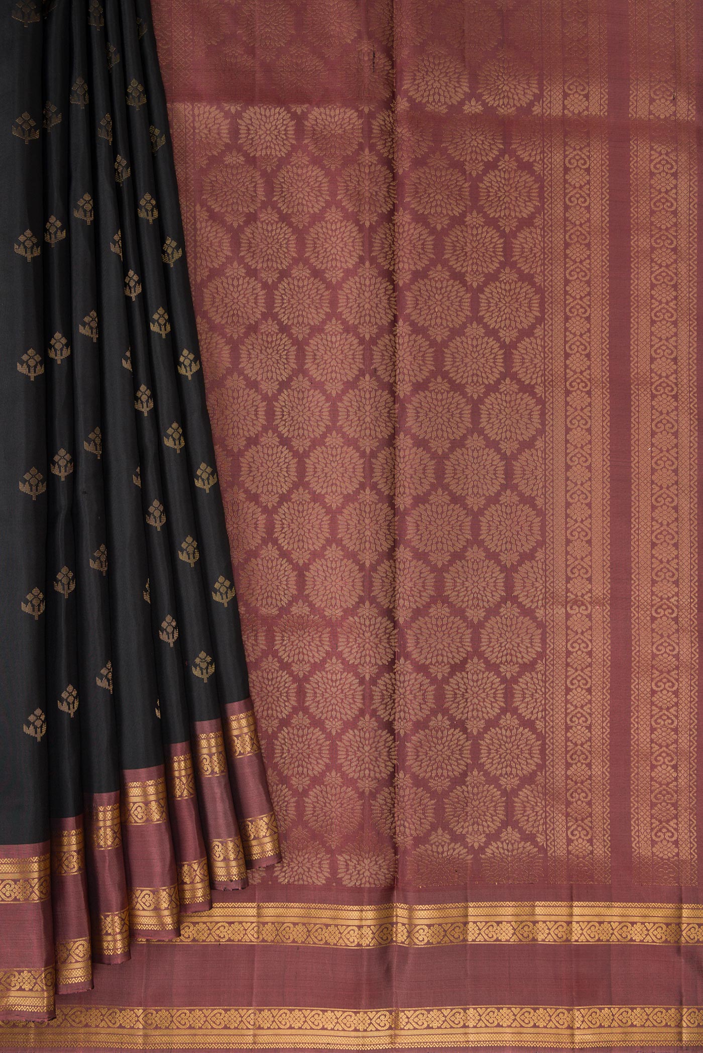 Pleats and pallu of Black Dual Tone Soft Silk Saree with Zari Butta on the body and Zari Border. 
