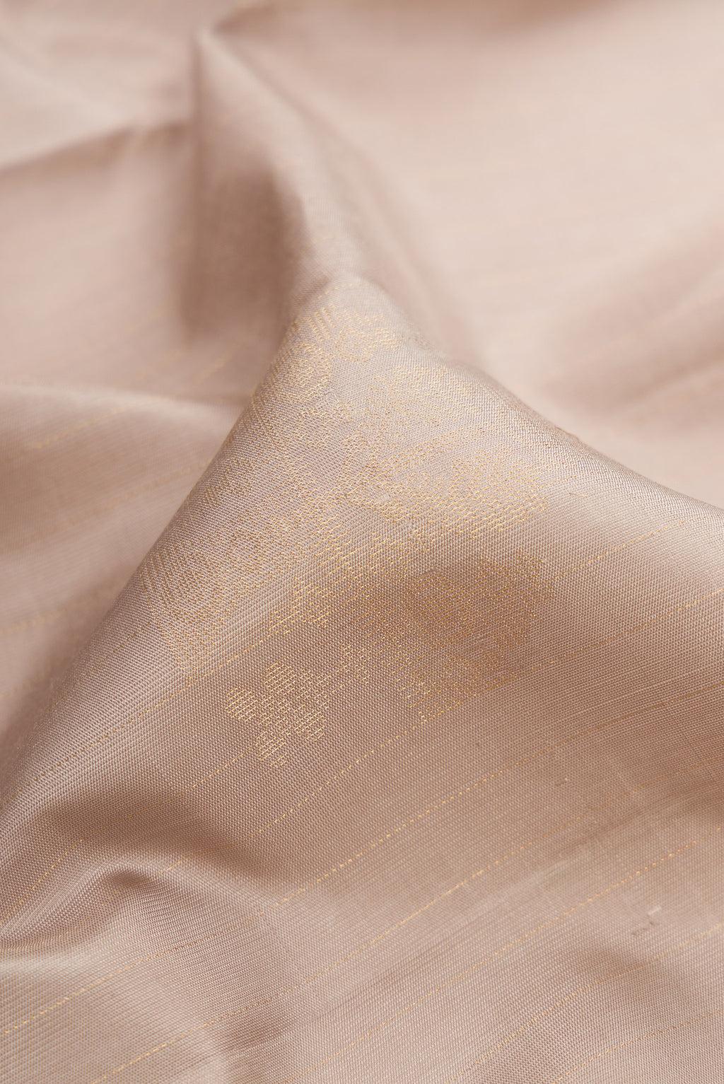Close up of Beige Dual Tone Soft Silk Saree with Stripes on the body and Without Border.  displaying folds