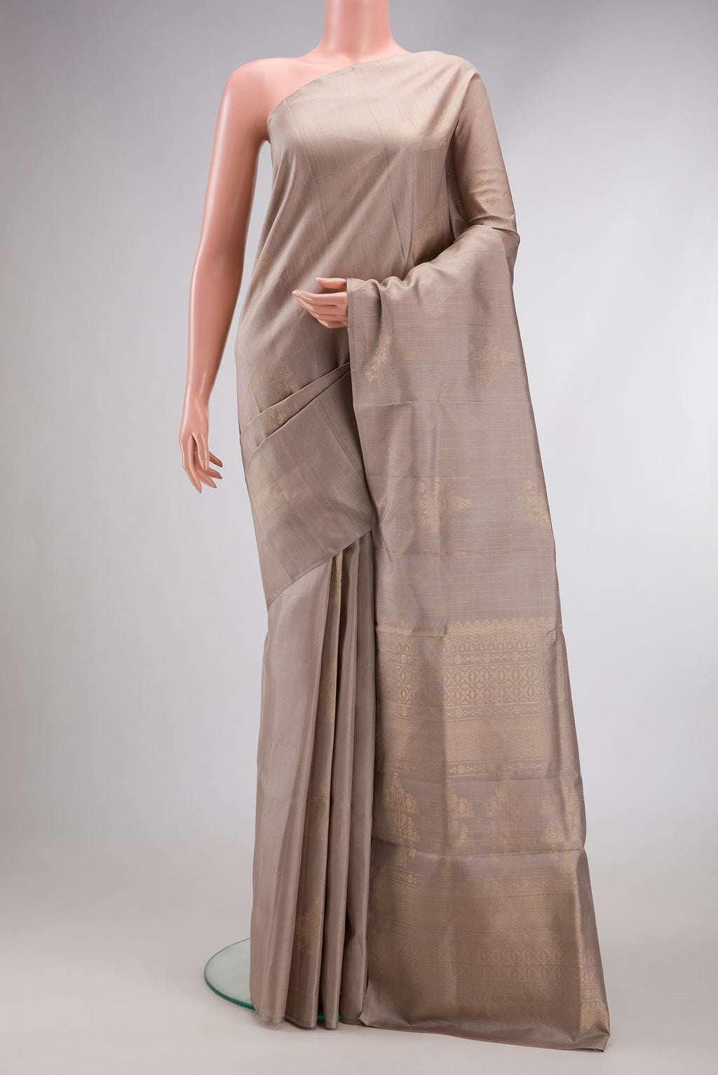 Beige Dual Tone Soft Silk Saree with Stripes on the body and Without Border.  displayed on a mannequin