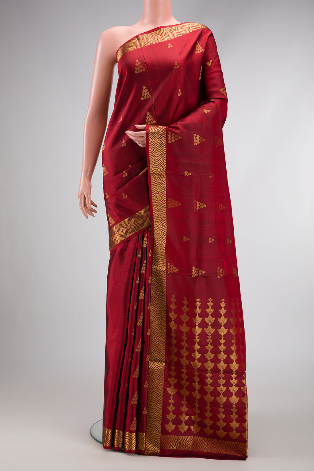 Maroon Dual Tone Soft Silk Saree with Zari Butta on the body and Zari Border.  displayed on a mannequin