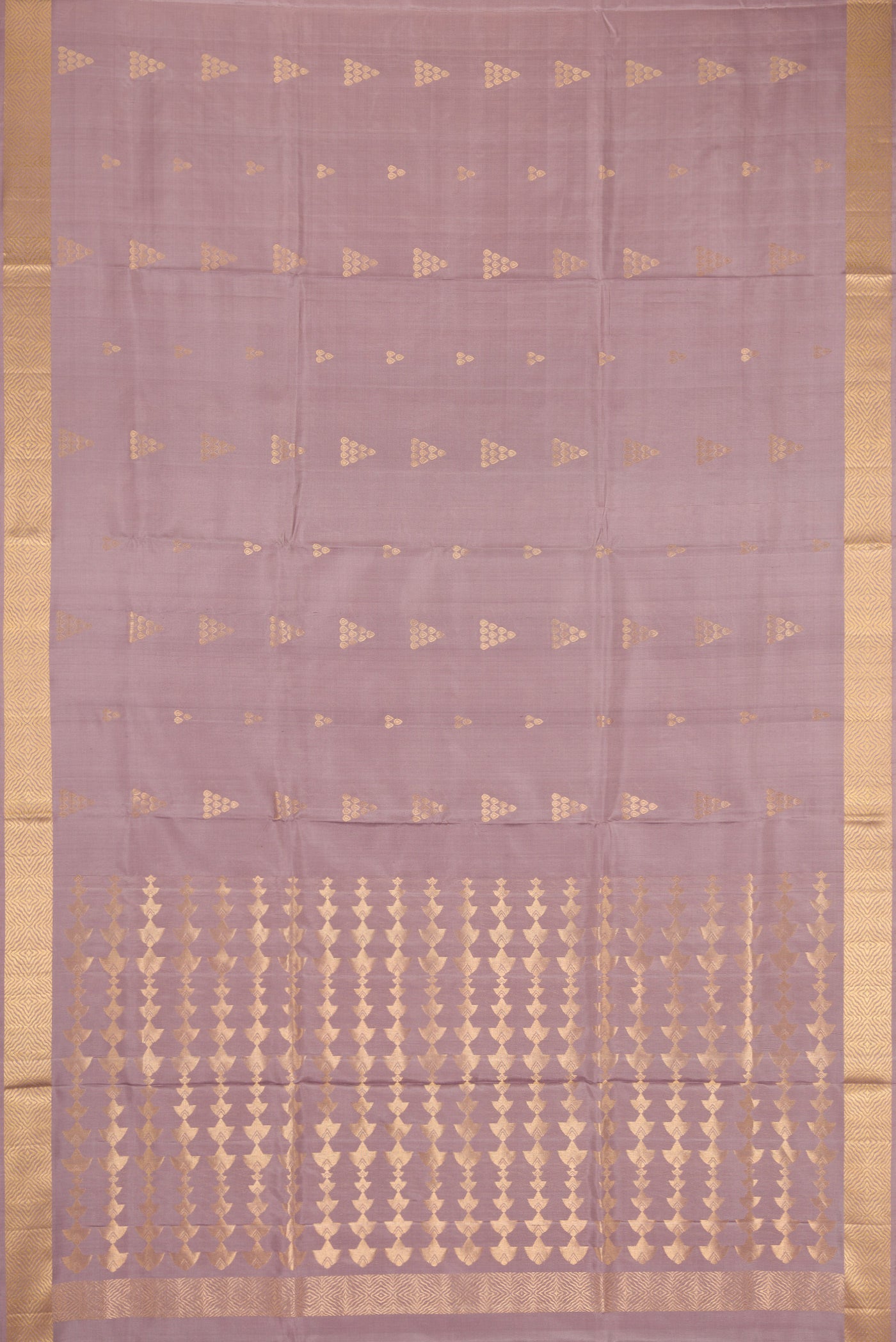 Flat view of Rose Gold Dual Tone Soft Silk Saree with Zari Butta on the body and Zari Border. 