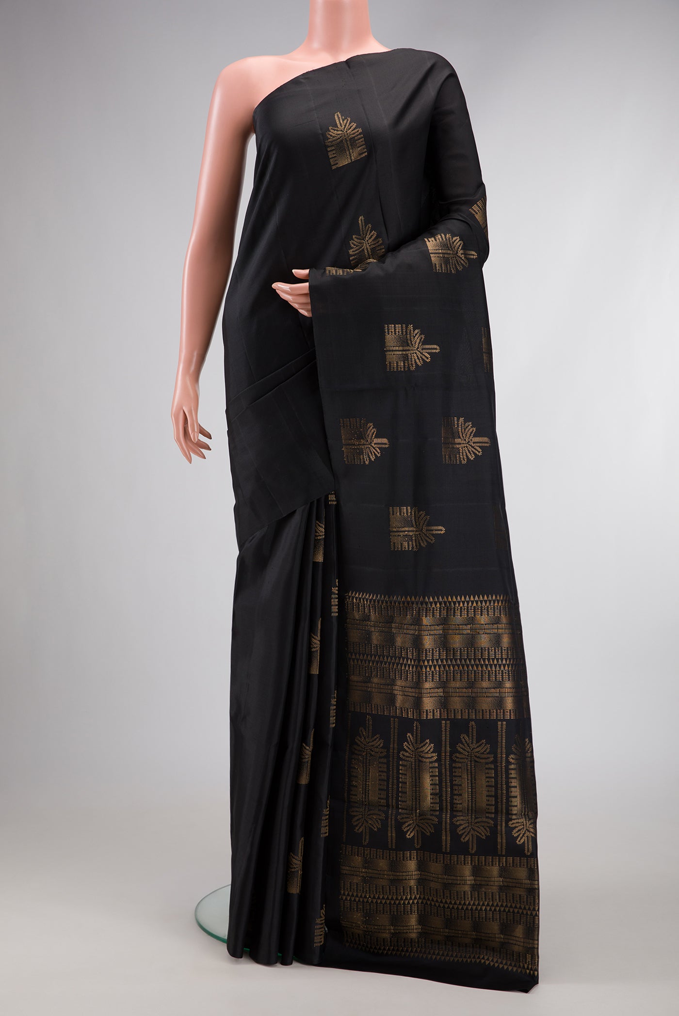 Black Dual Tone Soft Silk Saree with Zari Butta on the body and Without Border.  displayed on a mannequin