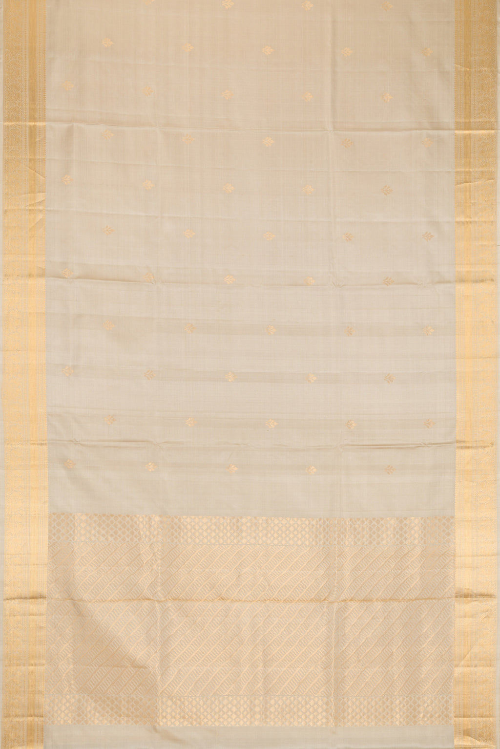 Flat view of Beige Dual Tone Soft Silk Saree with Zari Butta on the body and Zari Border. 