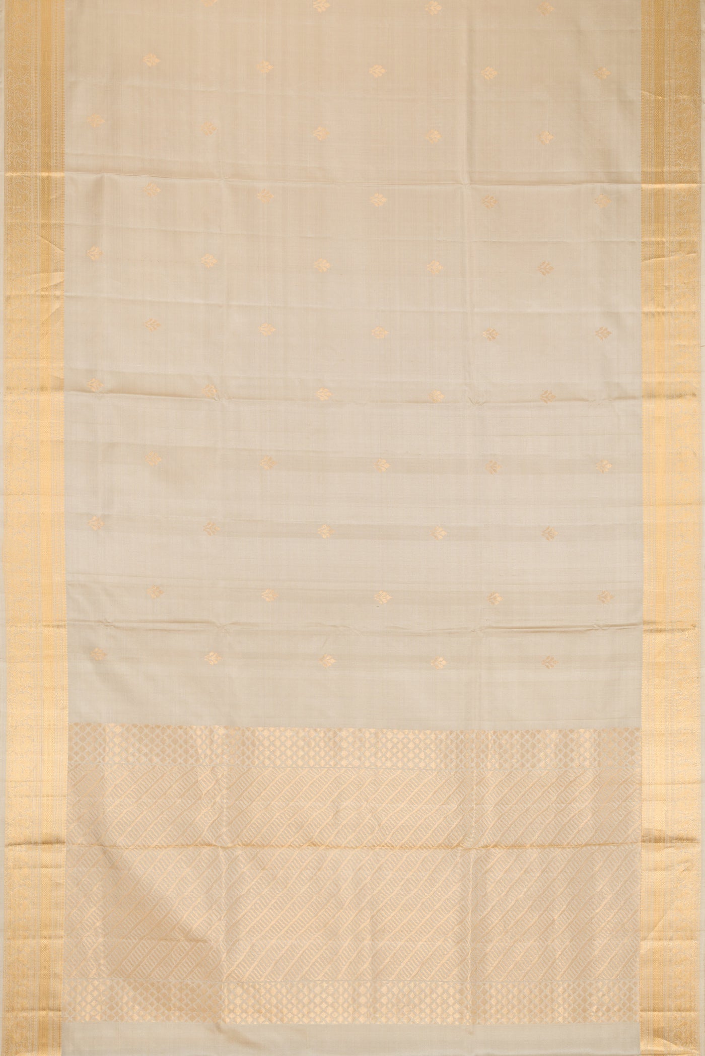 Flat view of Beige Dual Tone Soft Silk Saree with Zari Butta on the body and Zari Border. 