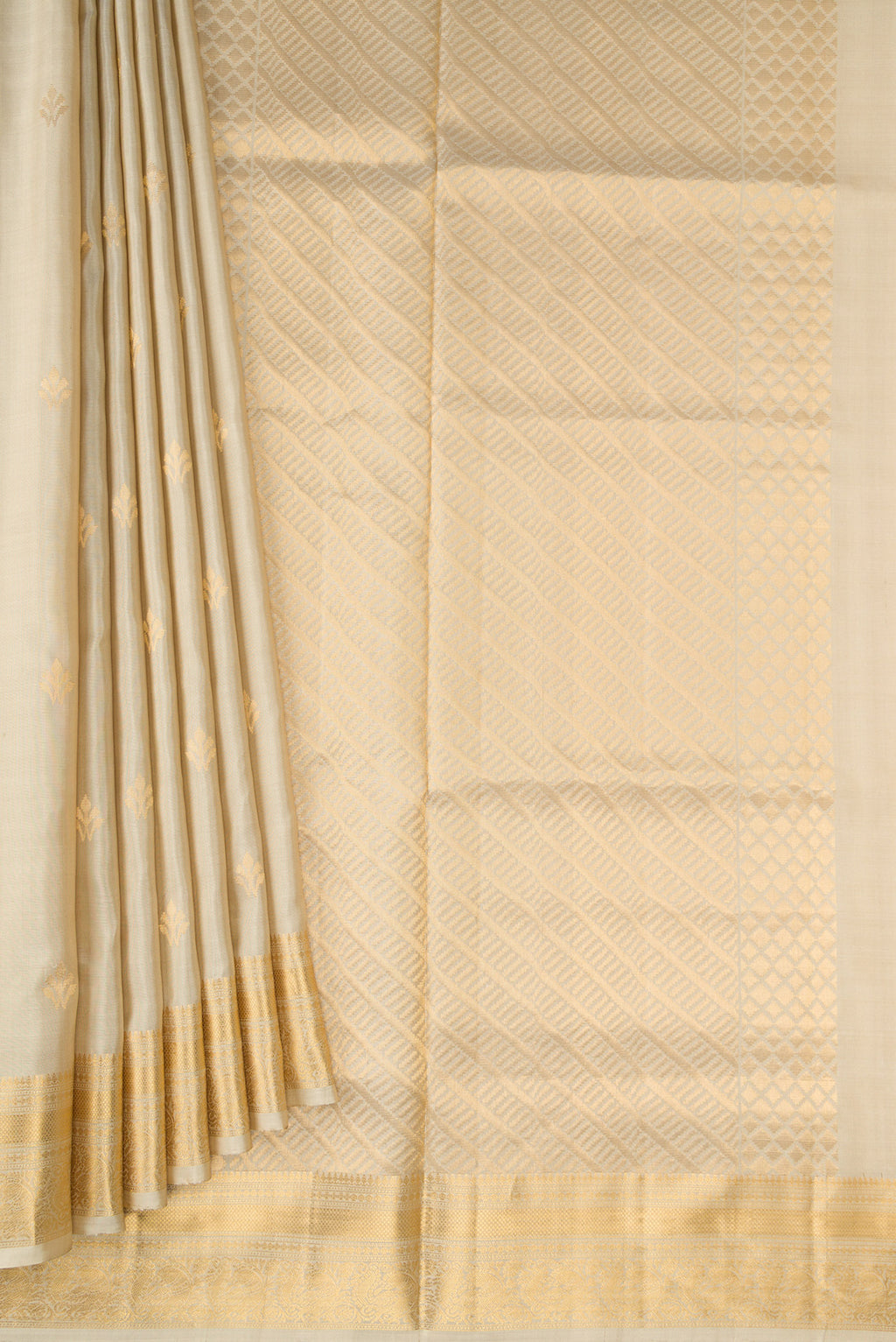 Pleats and pallu of Beige Dual Tone Soft Silk Saree with Zari Butta on the body and Zari Border. 