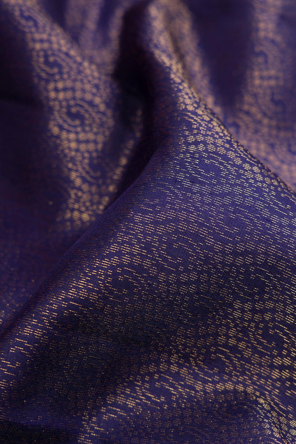 Close up of Navy Blue Dual Tone Soft Silk Saree with Zari Brocade on the body and Zari Border.  displaying folds