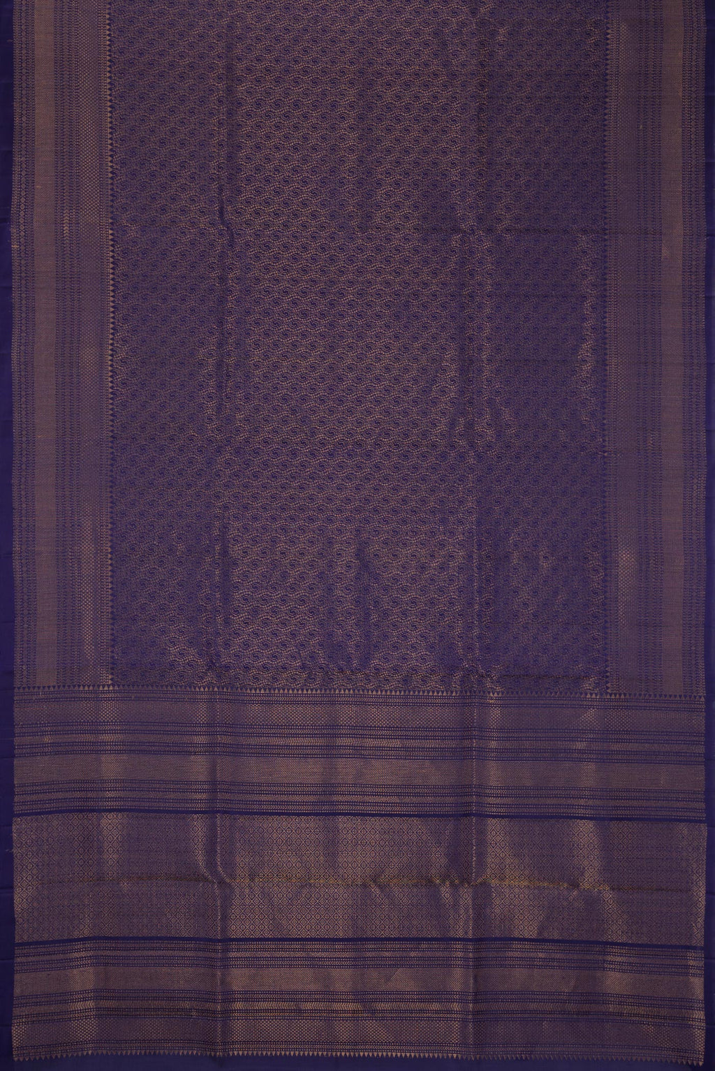 Flat view of Navy Blue Dual Tone Soft Silk Saree with Zari Brocade on the body and Zari Border. 