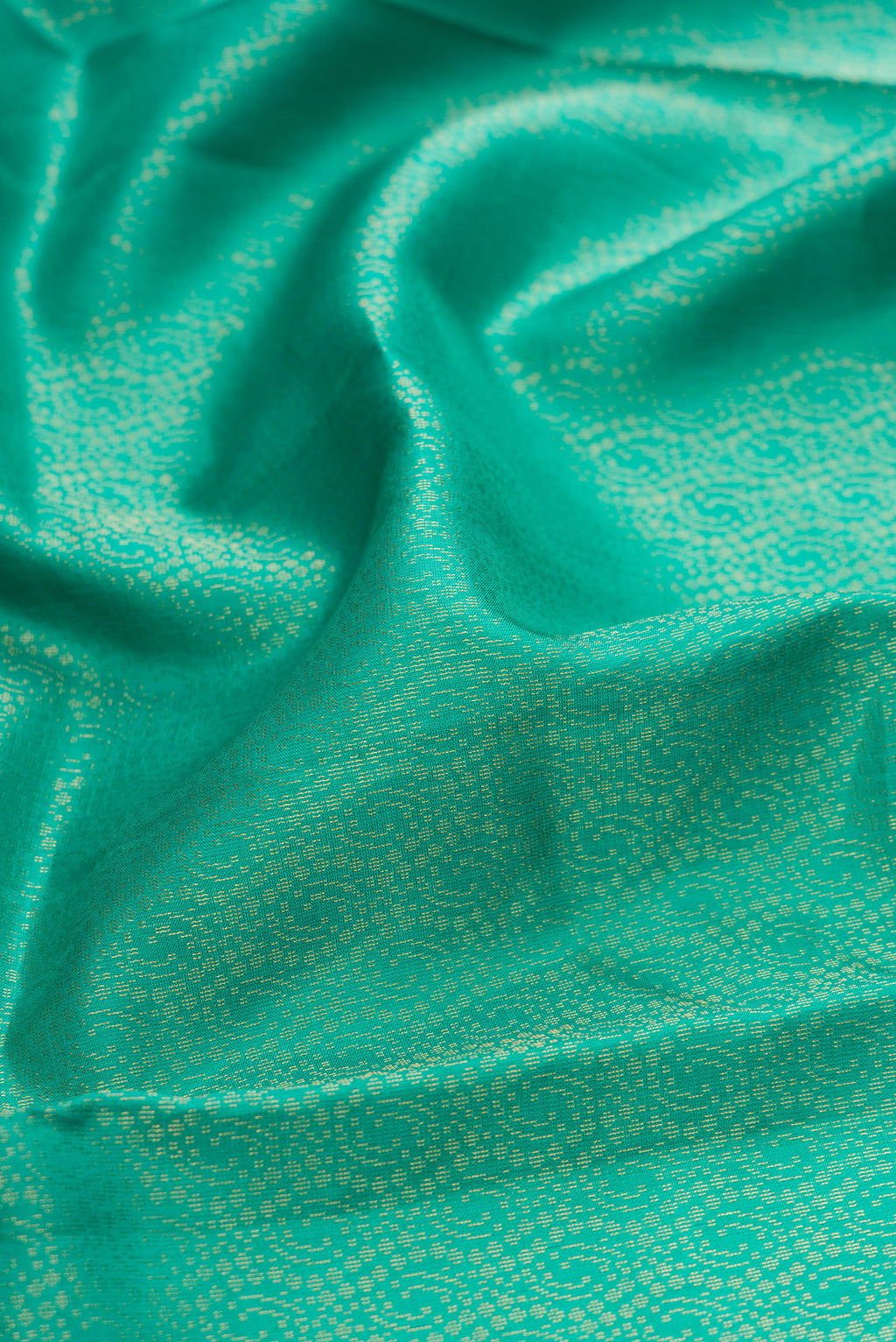 Close up of Sea Green Dual Tone Soft Silk Saree with Zari Brocade on the body and Fancy Border.  displaying folds