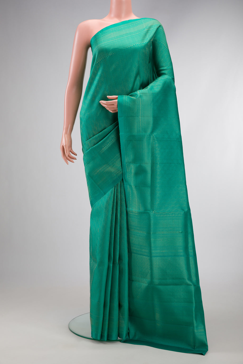 Sea Green Dual Tone Soft Silk Saree with Zari Brocade on the body and Fancy Border.  displayed on a mannequin