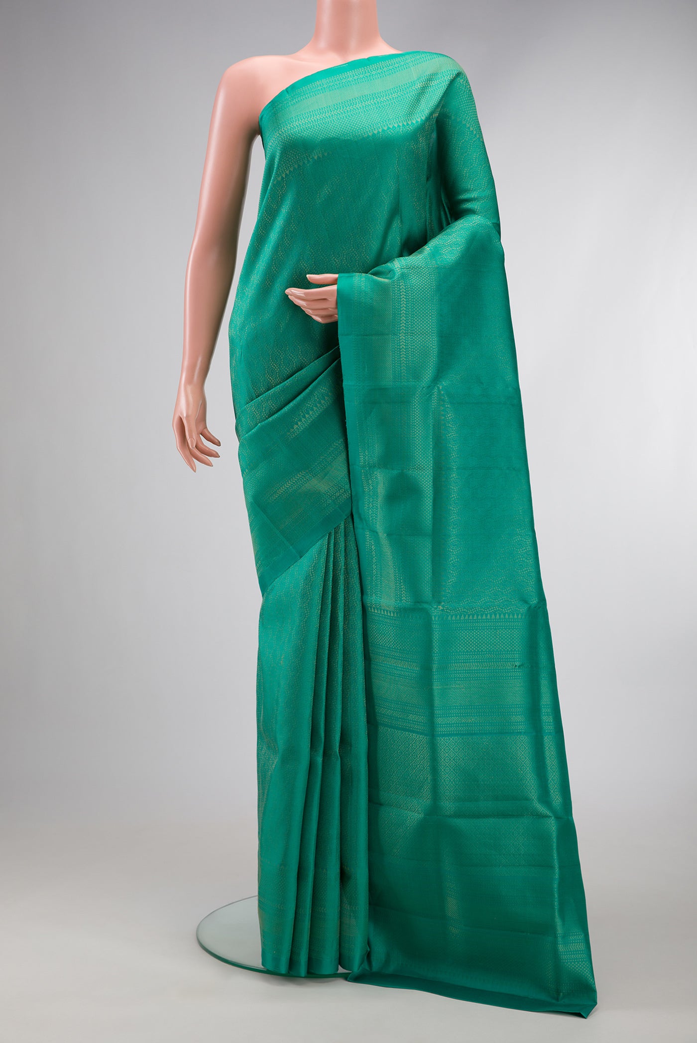 Sea Green Dual Tone Soft Silk Saree with Zari Brocade on the body and Fancy Border.  displayed on a mannequin