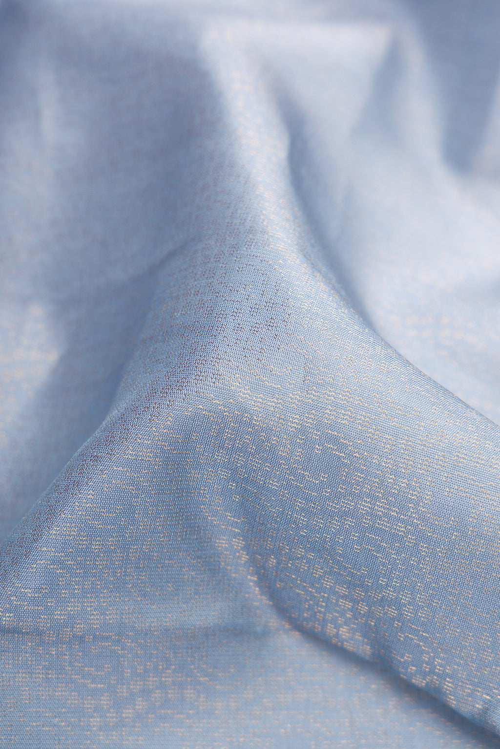 Close up of Grey Dual Tone Soft Silk Saree with Zari Brocade on the body and Zari Border.  displaying folds