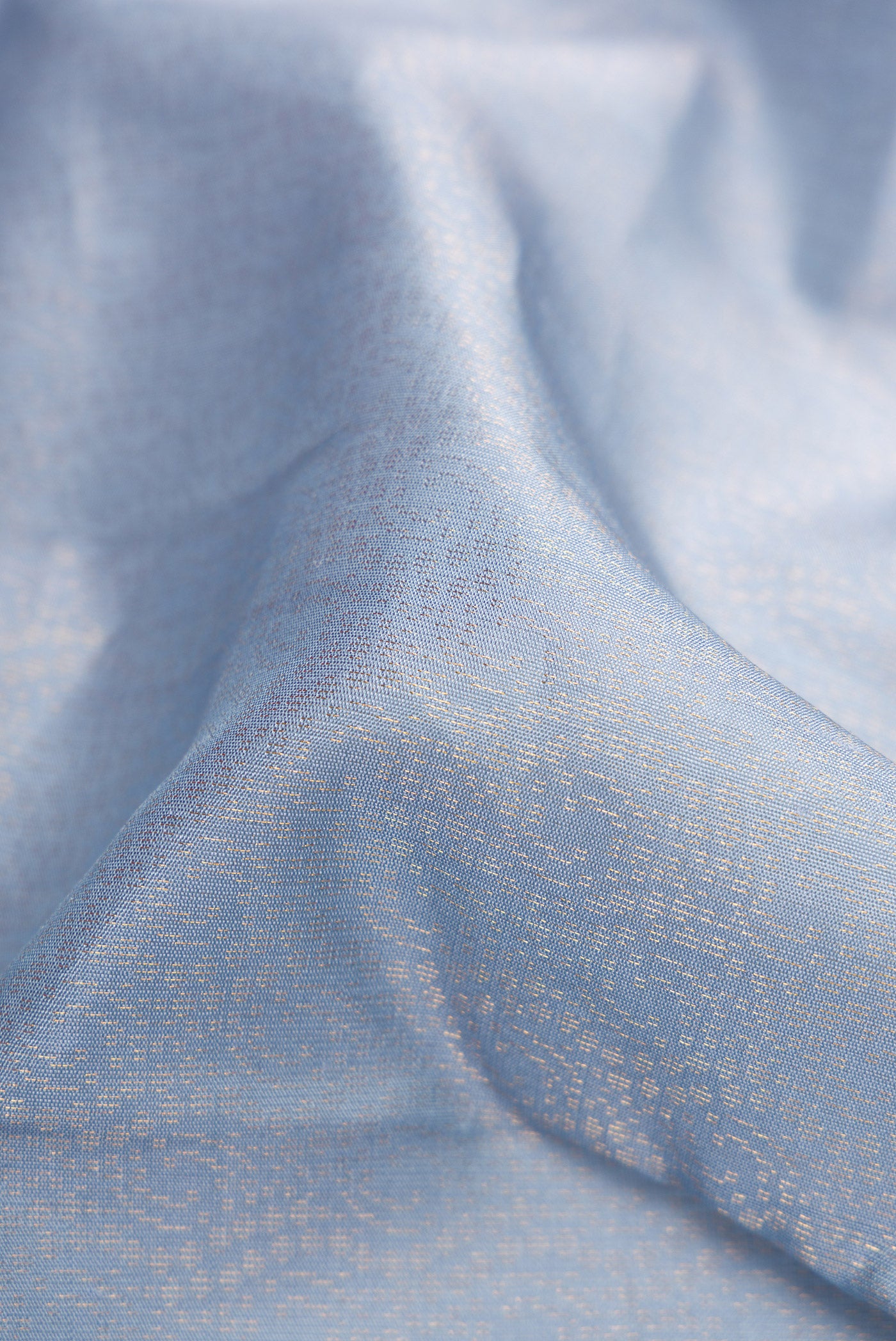 Close up of Grey Dual Tone Soft Silk Saree with Zari Brocade on the body and Zari Border.  displaying folds