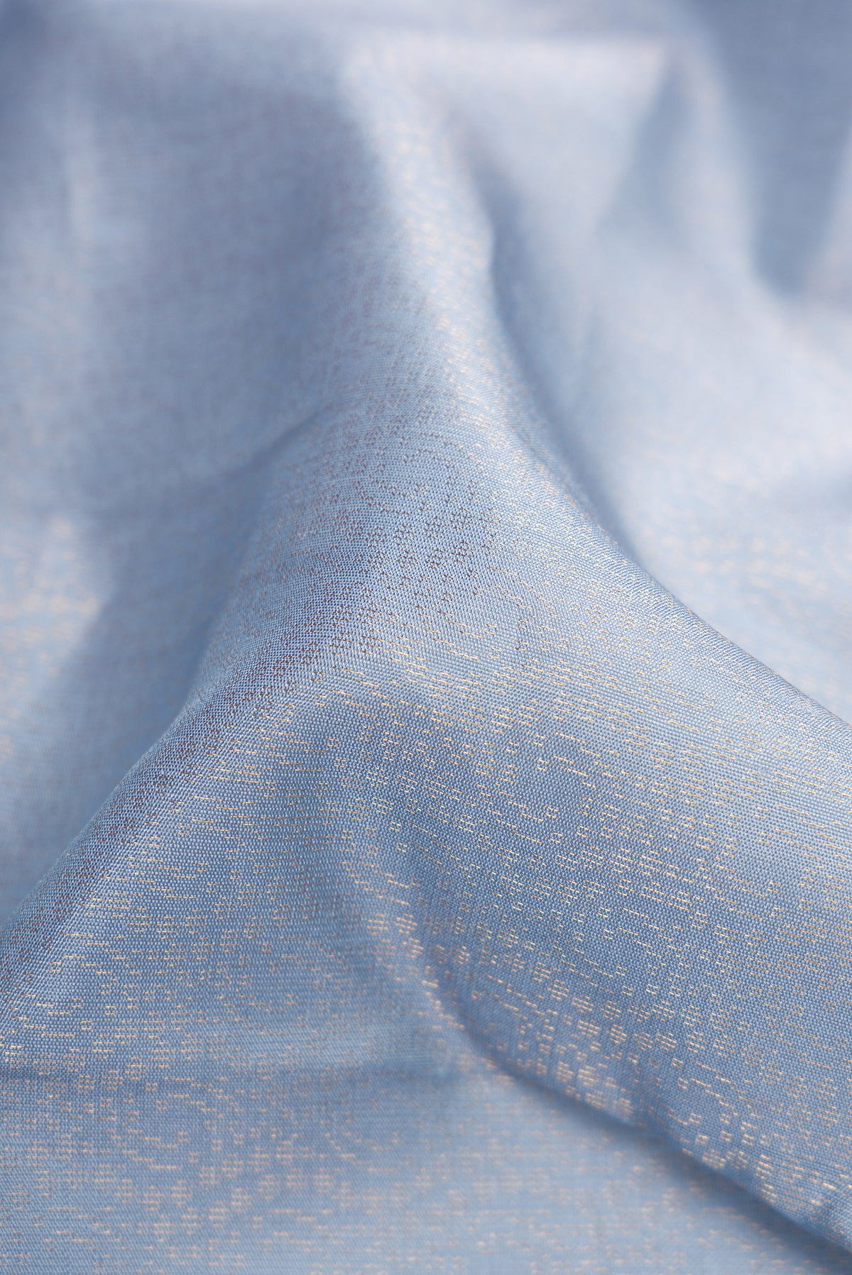 Close up of Grey Dual Tone Soft Silk Saree with Zari Brocade on the body and Zari Border.  displaying folds