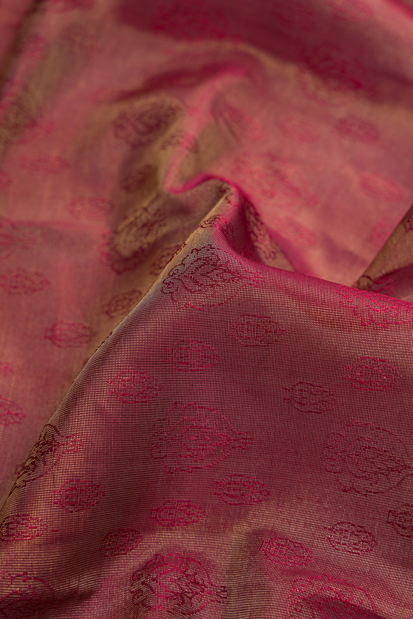 Close up of Maroon Dual Tone Kanchipuram Tissue Silk Saree with Zari Brocade on the body and Zari Border.  displaying folds