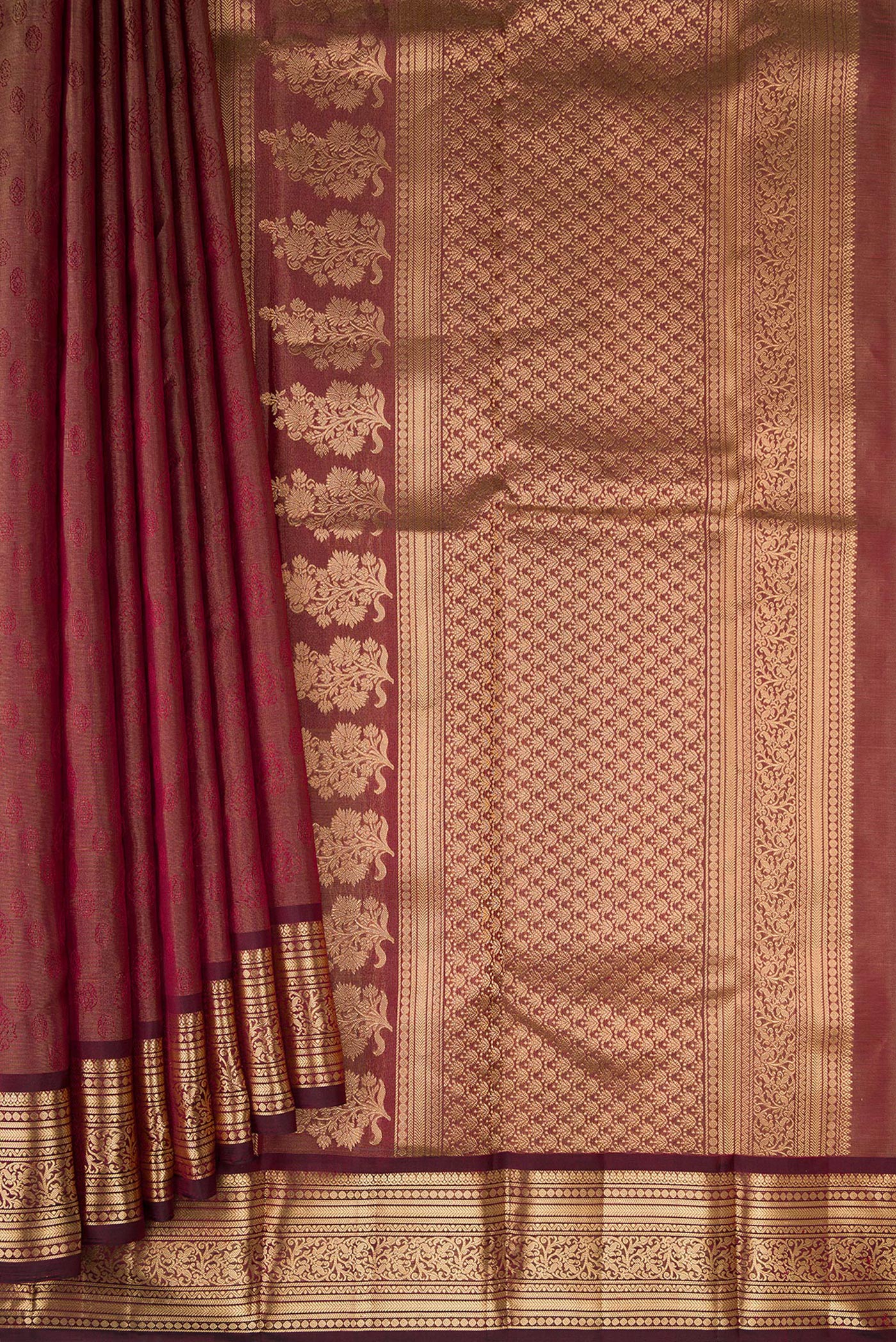 Pleats and pallu of Maroon Dual Tone Kanchipuram Tissue Silk Saree with Zari Brocade on the body and Zari Border. 