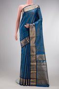 Maya Blue Dual Tone Kanchipuram Tissue Silk Saree with Zari Brocade on the body and Zari Border.  displayed on a mannequin
