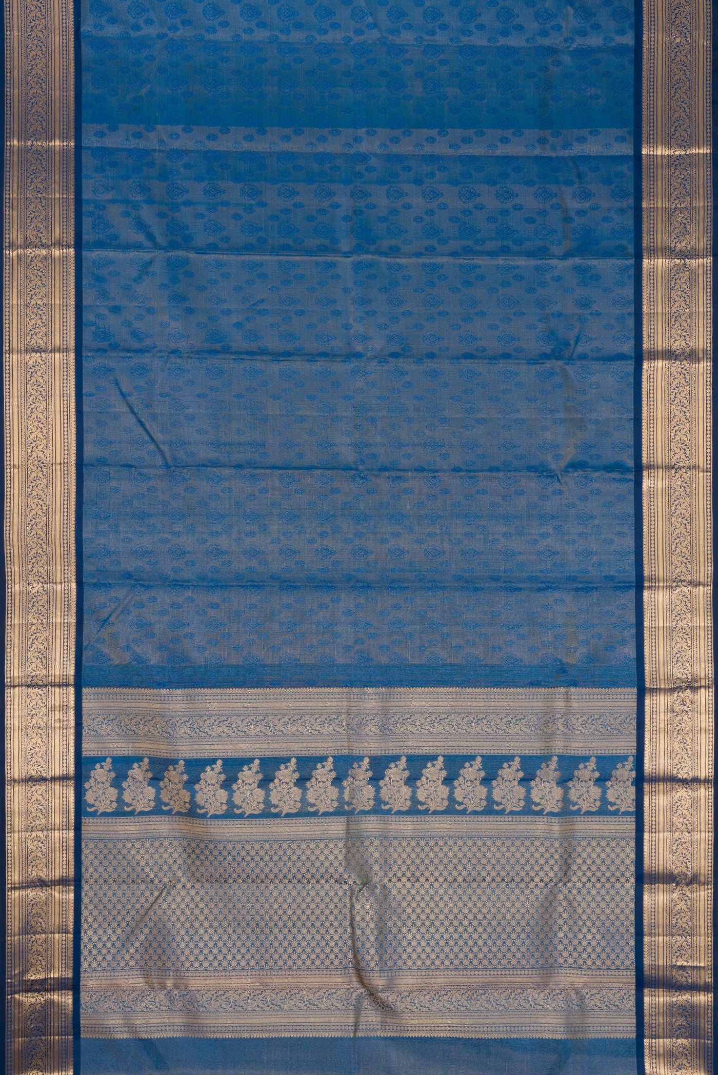 Flat view of Maya Blue Dual Tone Kanchipuram Tissue Silk Saree with Zari Brocade on the body and Zari Border. 
